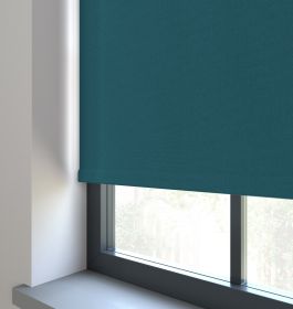 Our Amor Ocean Green Roller blind in a living room window.