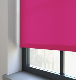 Our Burst Vibrant Pink dimout roller blind in the living room window.