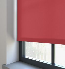 A dimout roller blind in a window