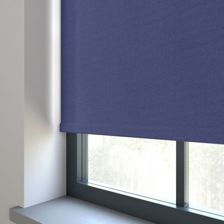 Our Amor Navy Blue Roller blind in a living room window.