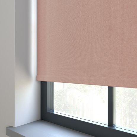 Our Amor Champagne Pink Roller blind in a living room window.