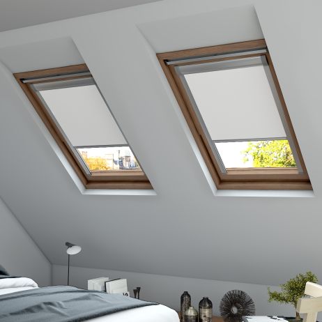 A close up of a white skylight blind in a window