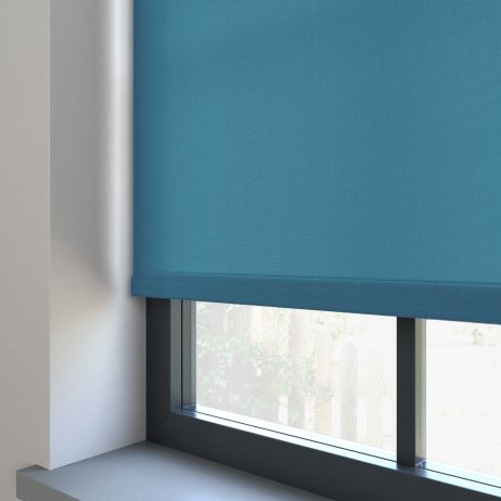 Our Burst Pastel Blue dimout roller blind in the bedroom window.