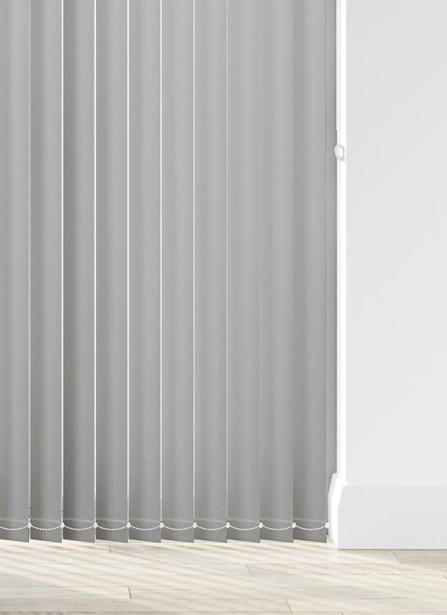A grey vertical blind in a kitchen window