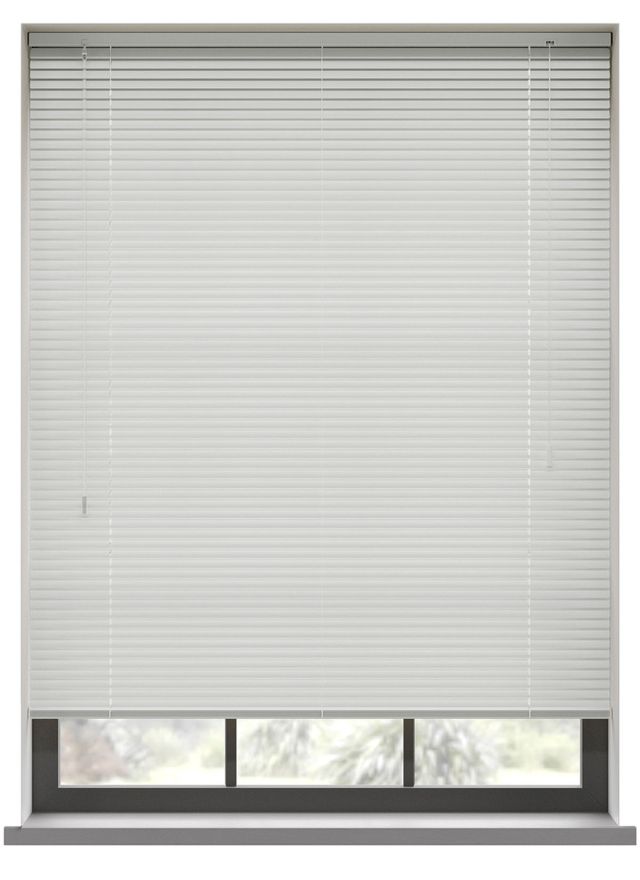 A white aluminium venetian blind in a window