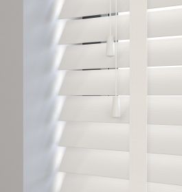 Editions Chiffon With Jasmine White Tape - A close up of a closed off white venetian faux wooden blind
 
