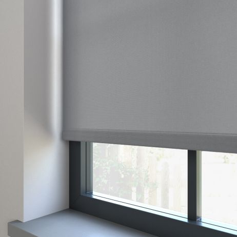 A dimout roller blind in a window