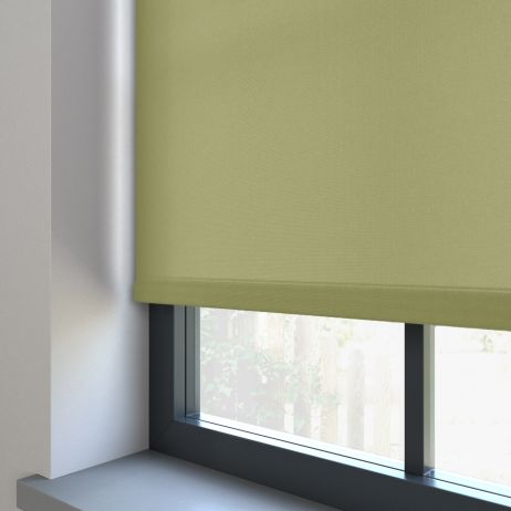 A green dimout roller blind in a window