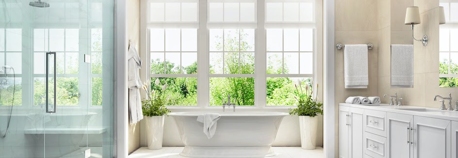 Bathroom window ideas: Bright and cheery bathroom with tub at centre