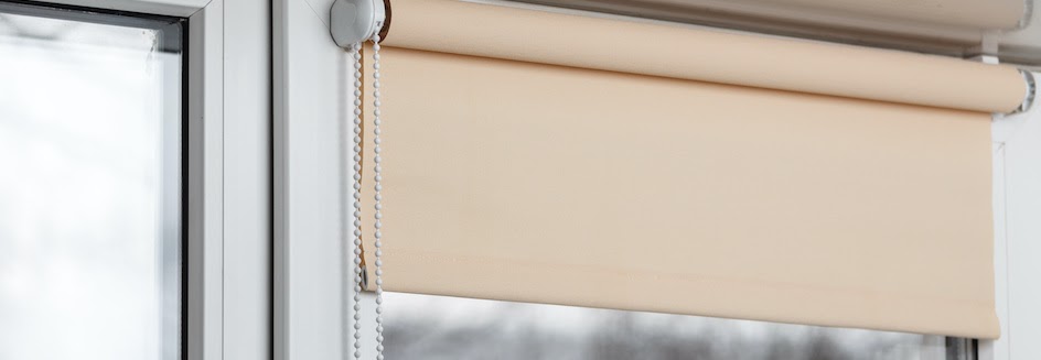 Closeup of tan blackout blinds