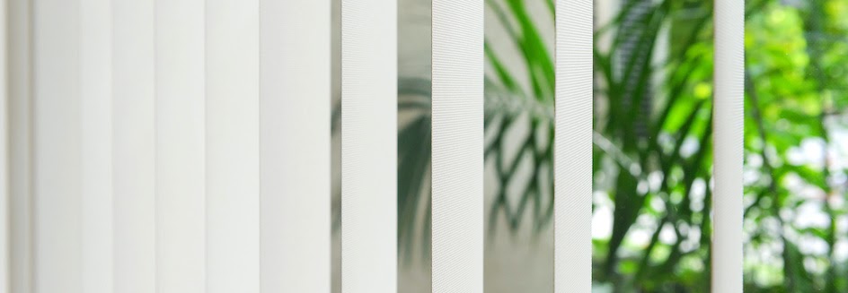 Closeup of white vertical blinds slats