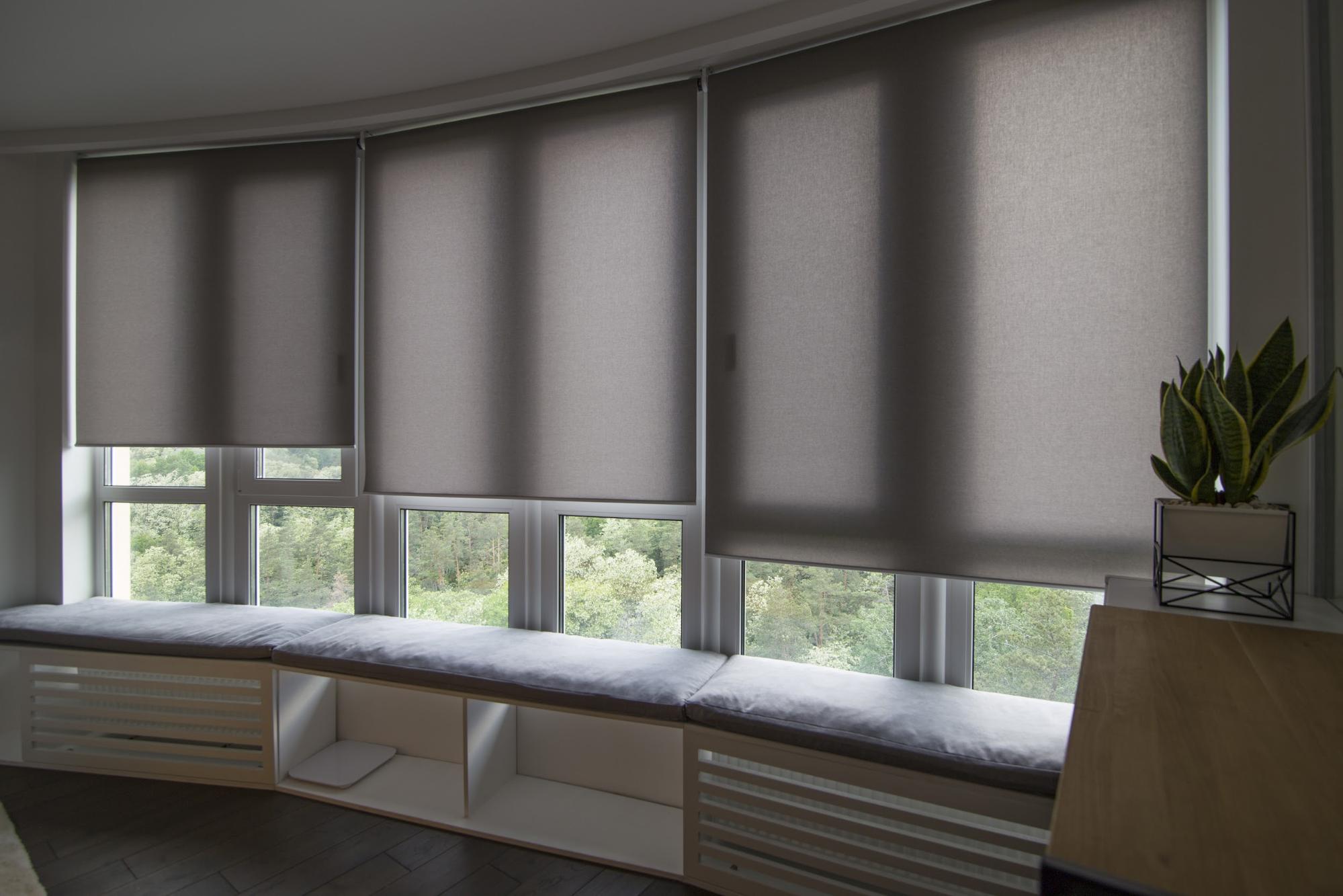 Three windows with sheer roller blinds