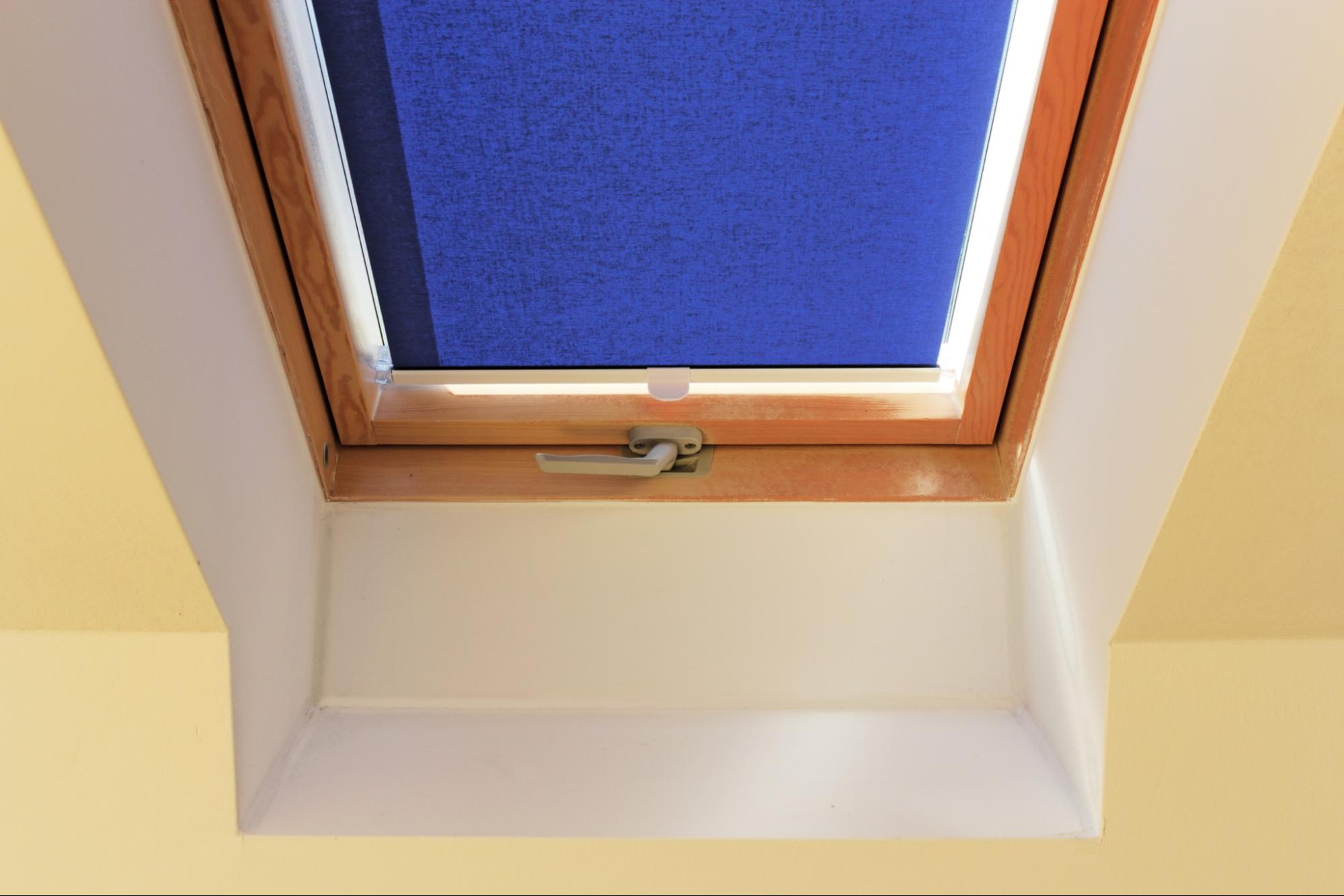fitting Velux skylight blinds